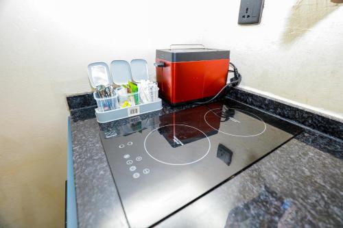 a coffee maker on a counter in a room at CoastalCharms Zanzibar in Zanzibar City