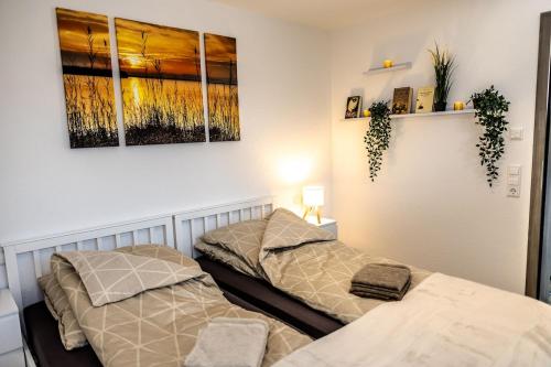 two beds sitting next to each other in a room at Ferienwohnung Elsbeth in Biberach an der Riß