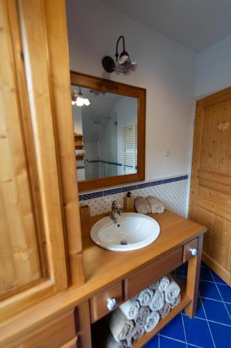 a bathroom with a sink and a mirror at CHALET MACESEN Apartment Mauro with sauna - in the center of Kranjska gora in Kranjska Gora