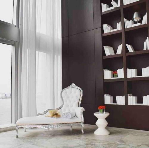 a white chair in a room with a window at Sun&Sea IconBrickell Unit in Miami