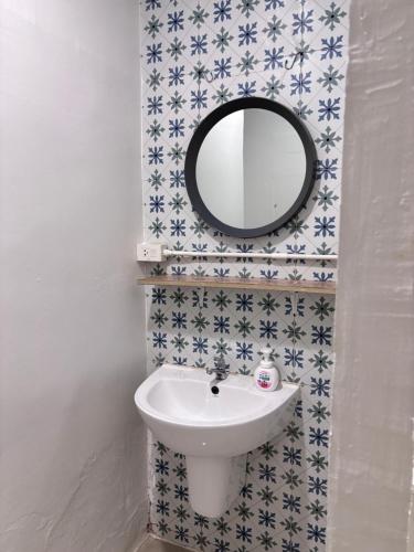 a bathroom with a sink and a mirror at Stay Together 3BR walkable to Nimman 6 Guests in Chiang Mai