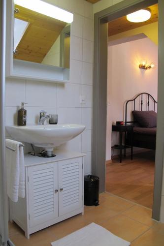 a bathroom with a sink and a mirror at Café des Voyageurs Noës in Chalais