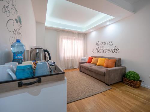 a living room with a couch and a table at Bartolo Suite Centro Storico Perugia in Perugia