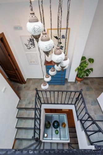 a staircase with a bunch of donuts in a room at La Casa del Risco Zahara in Zahara de la Sierra