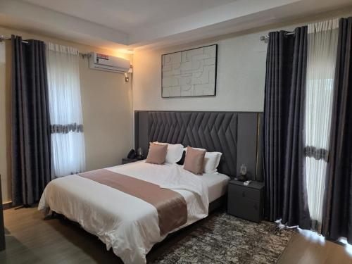 Krevet ili kreveti u jedinici u okviru objekta Glimpse Hotel