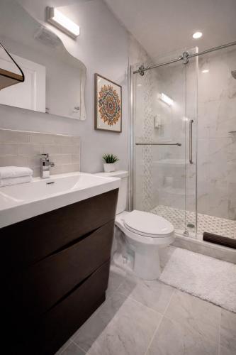 a bathroom with a sink and a toilet and a shower at Artsy Hidden Gem ll -Free Parking -- in Philadelphia
