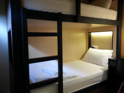 a view of a bunk bed in a room at Hotel 1000 Miles in Kuala Lumpur