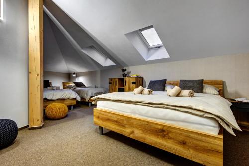 a bedroom with two beds in a room at TRIA House Liptov in Ižipovce