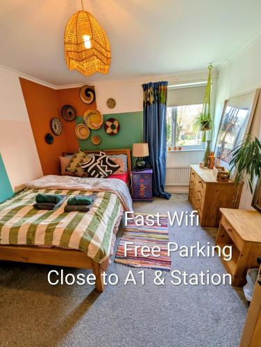 a bedroom with a bed with a tree pattern at Peterborough 3 Bed, Sleeps 6, Free parking, Fast WiFi, Contractors and Family Stay in Peterborough