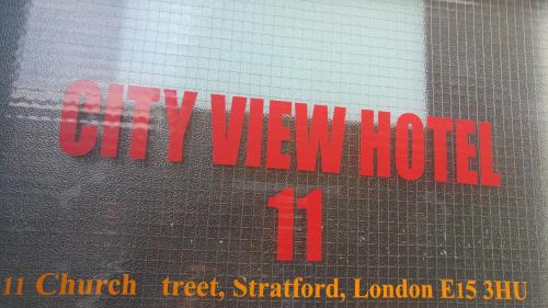 a sign that says city view hotel on a window at City View Hotel Stratford in London