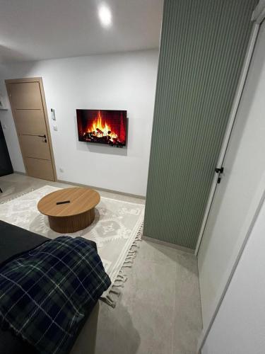 a living room with a fire in the wall at Studio 2 personnes maximum in Saint-Andiol