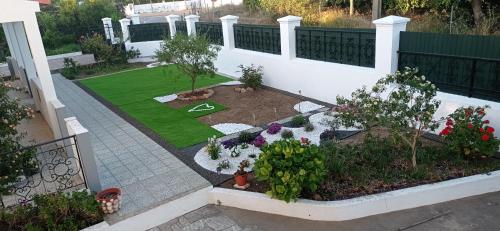 an aerial view of a garden with flowers and plants at Casa da Amoreira in Luz de Tavira