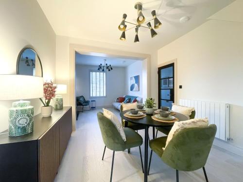 a dining room and living room with a table and chairs at The Haven in Banbridge