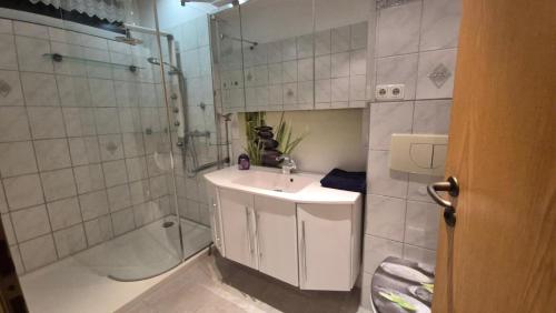 a bathroom with a sink and a shower and a sink at Haus Ferien Bock in Clausthal-Zellerfeld