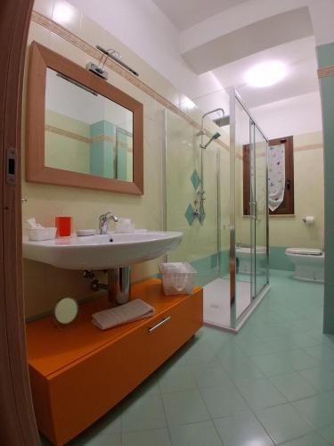 a bathroom with a sink and a shower at Suite Isernia Centro in Isernia
