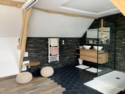 a bathroom with a toilet and a sink and a mirror at Cocon de Fontaine in La Madeleine-de-Nonancourt