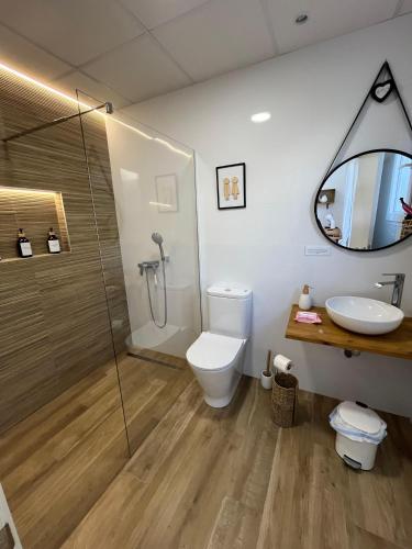 a bathroom with a shower and a toilet and a sink at Casa La Culle in Favareta