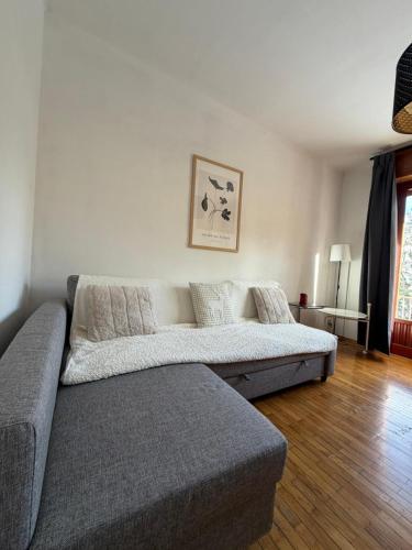 a living room with a couch in a room at Central near station in Bardonecchia