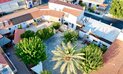 an overhead view of a courtyard with palm trees at The Courtyard Episkopi Guest Houses in Episkopi Limassol