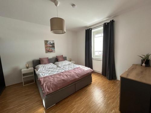 a bedroom with a bed and a window at Faraway Homes Studio Krieglach #7 in Sommer