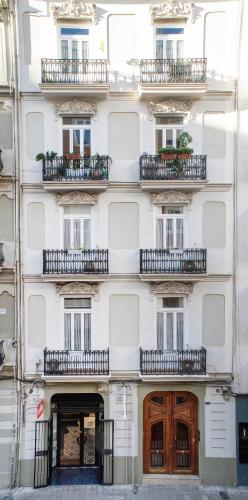 a white building with balconies on the side of it at ABCyou Bed&Breakfast in Valencia