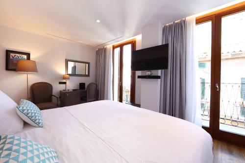 Ένα ή περισσότερα κρεβάτια σε δωμάτιο στο BO Hotel Palma