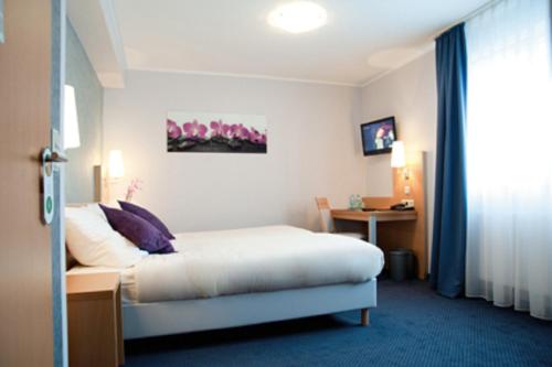 Postel nebo postele na pokoji v ubytování Hotel Beuss