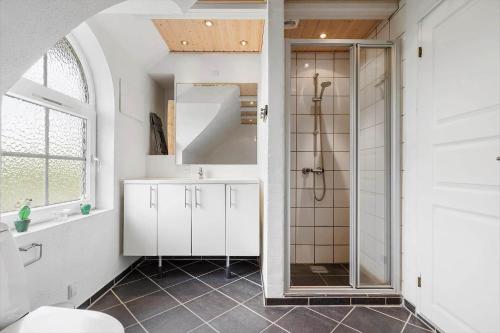 a bathroom with a shower and a sink at 5537-Hvide-Sande-Vesterledvej-14 in Havrvig