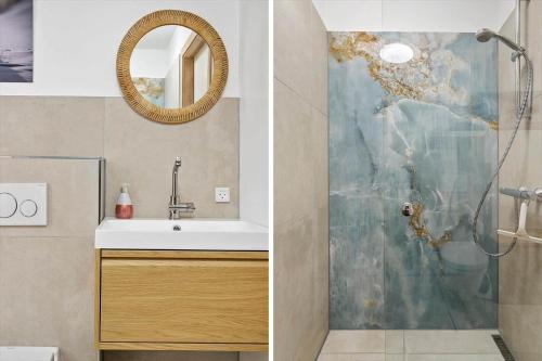 a bathroom with a sink and a shower at 731-Hvide-Sande-Slusen-31 in Hvide Sande