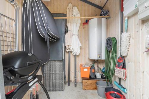 a garage with a bike parked in a room at 604-Hvide-Sande-Bjerregardsvej-193 in Bjerregård