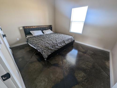 a bedroom with a bed with two pillows and a window at Special Deal on 2 Bedroom Unit 556 in Paris