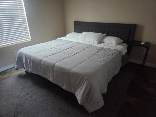 a bedroom with a large bed with white sheets and pillows at Special Deal on Booking Unit-558 in Paris