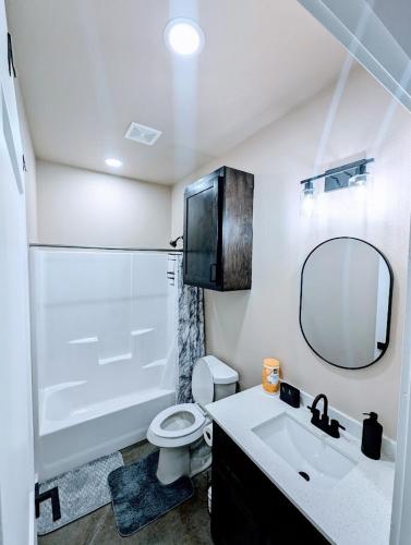 a bathroom with a sink and a toilet and a mirror at Special Deal on Booking Unit-558 in Paris