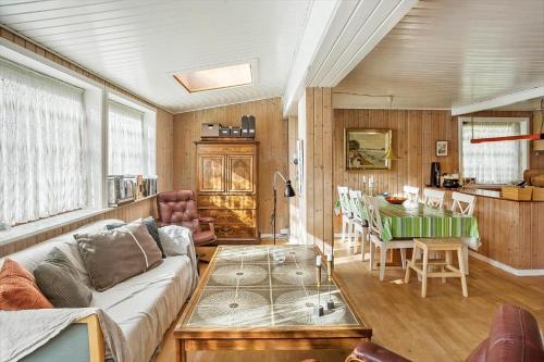 a living room with a couch and a table at 5015-Askeby-Gormsvej-5 in Askeby