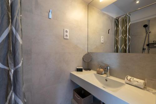 a bathroom with a sink and a mirror at Villa Can Tomeu Capdet in Sant Pere de Ribes