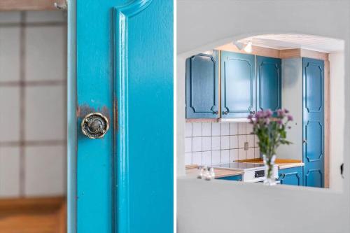 a blue door in a kitchen next to a counter at 369-Lemvig-Klostervej-39 in Lemvig