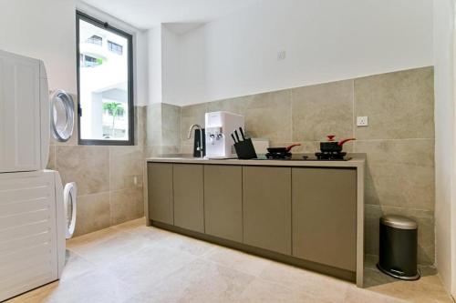 a kitchen with a counter with a appliance on it at Modern Luxury Villa Hinai by Simple Sanctuary in George Town