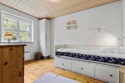 a bedroom with a bed and a window at 13387-Vig-Vej-11-4 in Vig