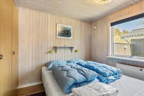 a large bed in a room with a window at LF14223-Roslev-Livovej-9 in Roslev
