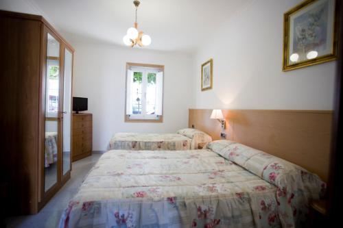 Postel nebo postele na pokoji v ubytování Hostal La Casilla