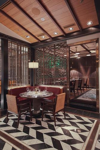a dining room with a table and chairs at Shangri-La Residences The Fort, Manila in Manila
