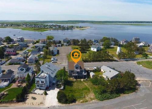 an island with a yellow circle on top of a house at Walk to Beach Playground Lighthouse North End in Newburyport