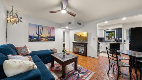 a living room with a blue couch and a table at The Casita Collective in Scottsdale