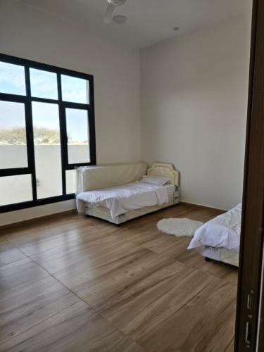 Postel nebo postele na pokoji v ubytování شاليه العهد