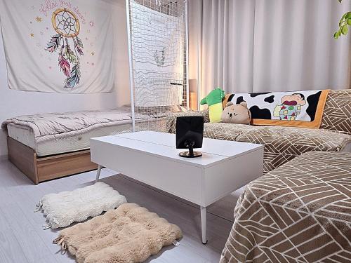 a bedroom with a white table and a bed at Your Stay in Seoul