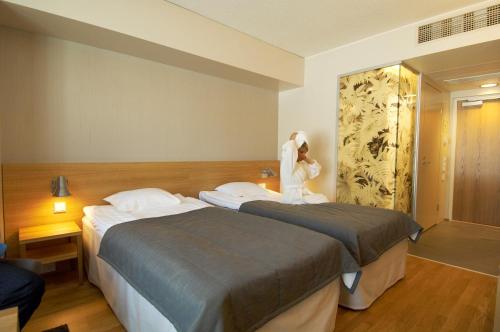 Katil atau katil-katil dalam bilik di Spa Hotel Peurunka