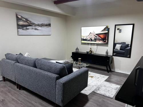 a living room with a couch and a piano at 6ALouieVille in Lusaka