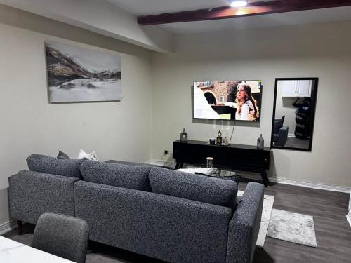 a living room with a couch and a piano at 6ALouieVille in Lusaka