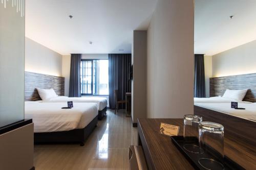 Postel nebo postele na pokoji v ubytování Spenza Hotel