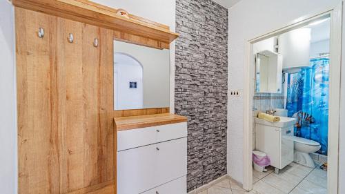 a bathroom with a sink and a toilet at Apartman Roza 1 by Villas Guide in Vela Luka